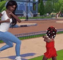 a woman is running with a little girl in a red dress .