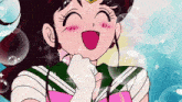 a girl in a sailor suit is smiling with bubbles around her