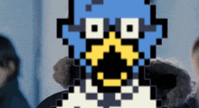 a pixel art of a person 's face with a penguin on it
