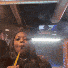 a woman is smoking a hookah in a restaurant