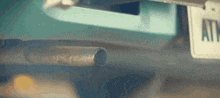 a close up of a car exhaust pipe with a tag that says all