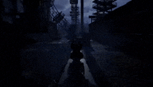 a person is holding a gun in a dark room with a tower in the background .
