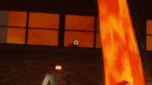 a cartoon character is standing in front of a building with a fire coming out of it .