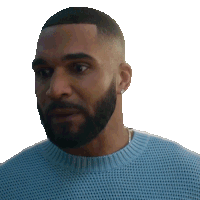 a man with a beard wearing a light blue sweater