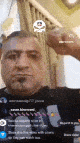 a man giving a thumbs up in front of a ufc cast logo