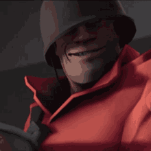 a man wearing a helmet and a red jacket smiles for the camera