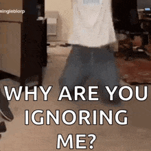 a man is walking in a room with the words " why are you ignoring me "