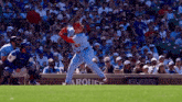 a baseball player with the number 33 on his jersey swings at a pitch