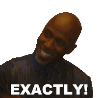 a bald man with a beard is smiling with the words exactly behind him