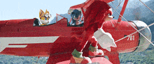 sonic the hedgehog and knuckles the echidna are flying in a red airplane .