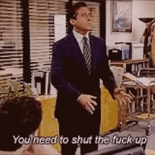 a man in a suit and tie says you need to shut the fuck up .