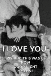 a black and white photo of a man and woman hugging each other on a bed .