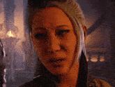 a close up of a woman 's face with a tear running down her cheek