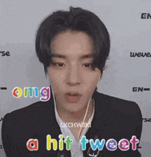 a close up of a person wearing headphones with the words `` omg a hit tweet '' above them .