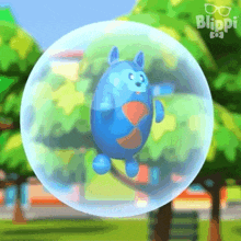 a blue cartoon character is flying through a bubble .