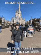a man is standing in front of a disney castle with a caption that says human resources ... the true happiest place on earth
