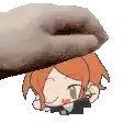 a hand is putting a cartoon character on top of a person 's head .