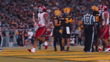 a football player with the number 1 on his jersey is running on the field