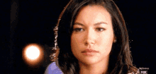 a close up of a woman 's face with the fox logo visible