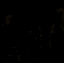 two women are standing next to each other with the word kiss in the corner