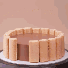 a pastry bag is being used to fill a chocolate cake