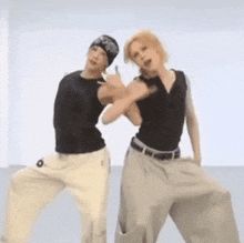 a man and a woman are standing next to each other and one of them has the number 6 on their pants