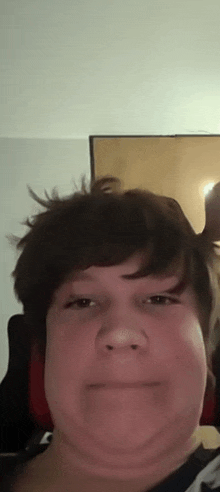 a close up of a person 's face with their hair blowing in the wind