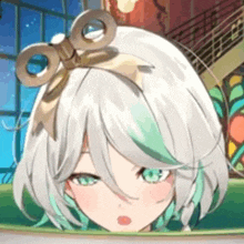 a close up of a girl with white hair and green eyes wearing a headband with a bow .