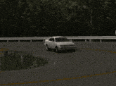 a white mark ii car is driving around a curve in a video game