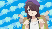 a girl in a purple hat is standing in front of jellyfish