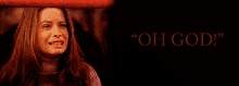a woman behind a red ring with the words " oh god " on the bottom
