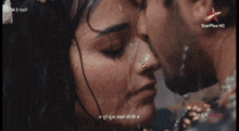 a man and woman kissing in the rain with a star plus hd logo