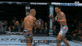 two men in a boxing ring with a sign that says vegas stronger on it
