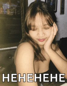 a picture of a woman with her eyes closed and a caption that says henehene