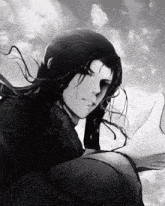 a black and white image of a man with long hair