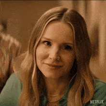 a close up of a woman 's face with netflix written on the bottom right