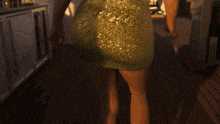 a woman in a green dress is standing on a deck
