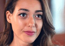 a close up of a woman 's face with a tear running down her cheek