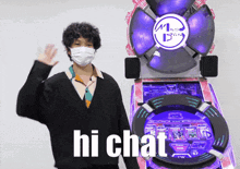 a man wearing a mask is waving in front of a hi chat machine