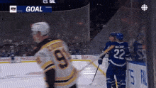 a hockey game is being played and the goal is displayed on the screen