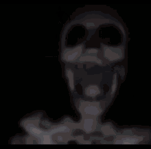 a skeleton is dancing on a black background in a dark room