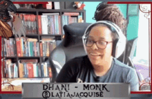 a woman wearing headphones and a sign that says chani monk