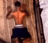 a man without a shirt is laying on a mattress
