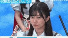 a girl with a name tag that says ' yoshi ' on it looks at the camera