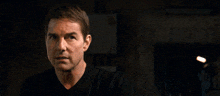 a man in a black shirt with the words no matter what behind him