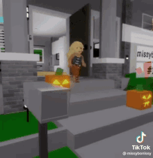 a girl is standing in front of a house with a pumpkin on the sidewalk .
