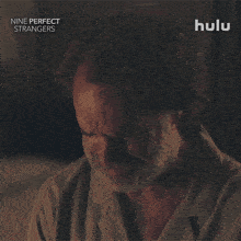 an advertisement for nine perfect strangers shows a man in pajamas