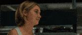 a man and a woman are looking into each other 's eyes while holding hands .