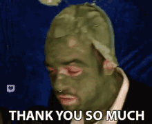 a man with a shrek mask on his face is saying thank you so much .