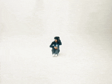 a person is sitting on the floor with their hands on their heads